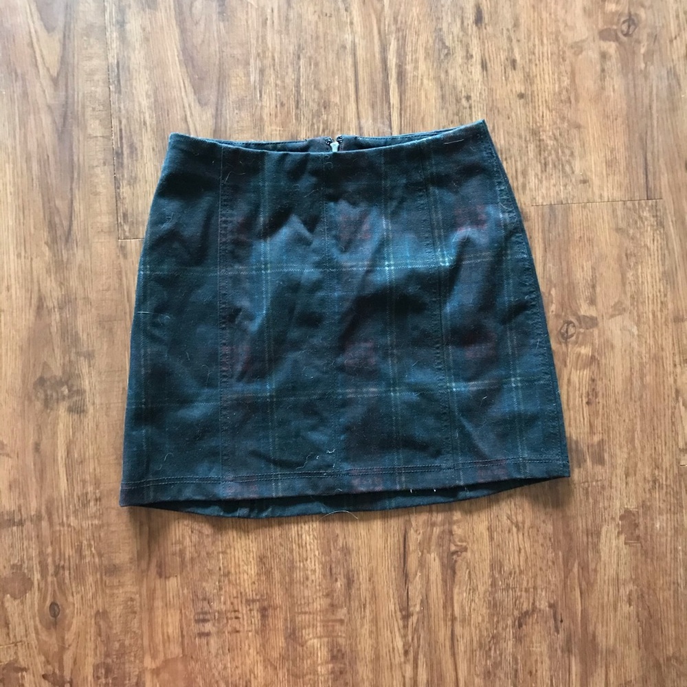 black miniskirt with slight plaid pattern